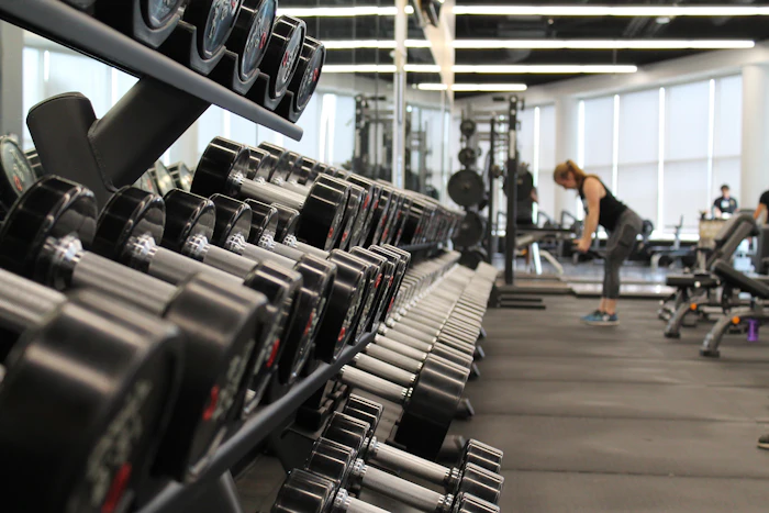 The dumbbell rack running the length of the strength floor